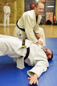 Hapkido class - two blackbelts doing martial arts techniques